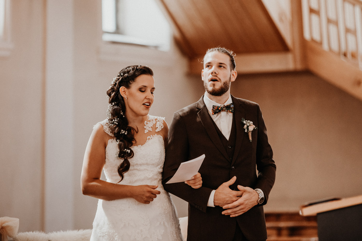 wedding photographer switzerland bride groom church wedding singing