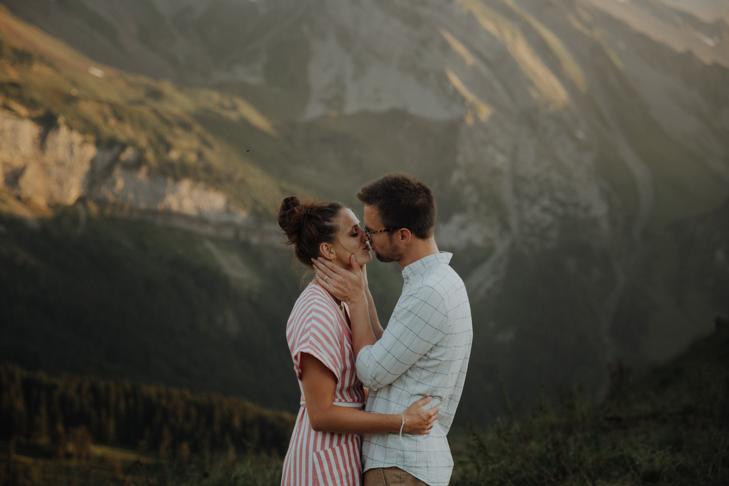 couple kissing in the Swiss mountains photographed by elopement photographer from Switzerland