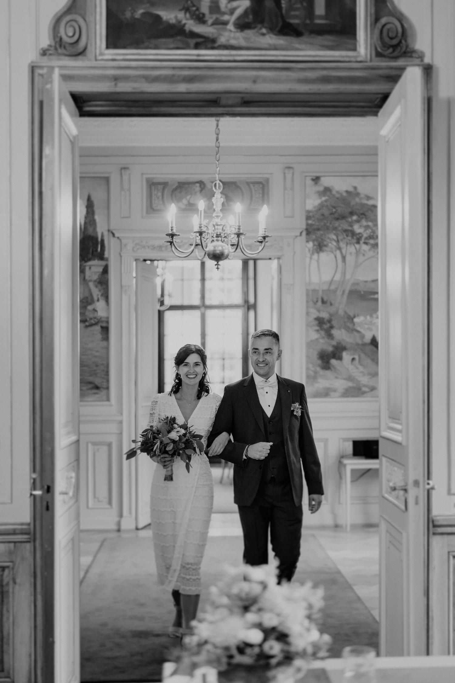 Bride and her father walk in at the civil wedding in Basel Switzerland