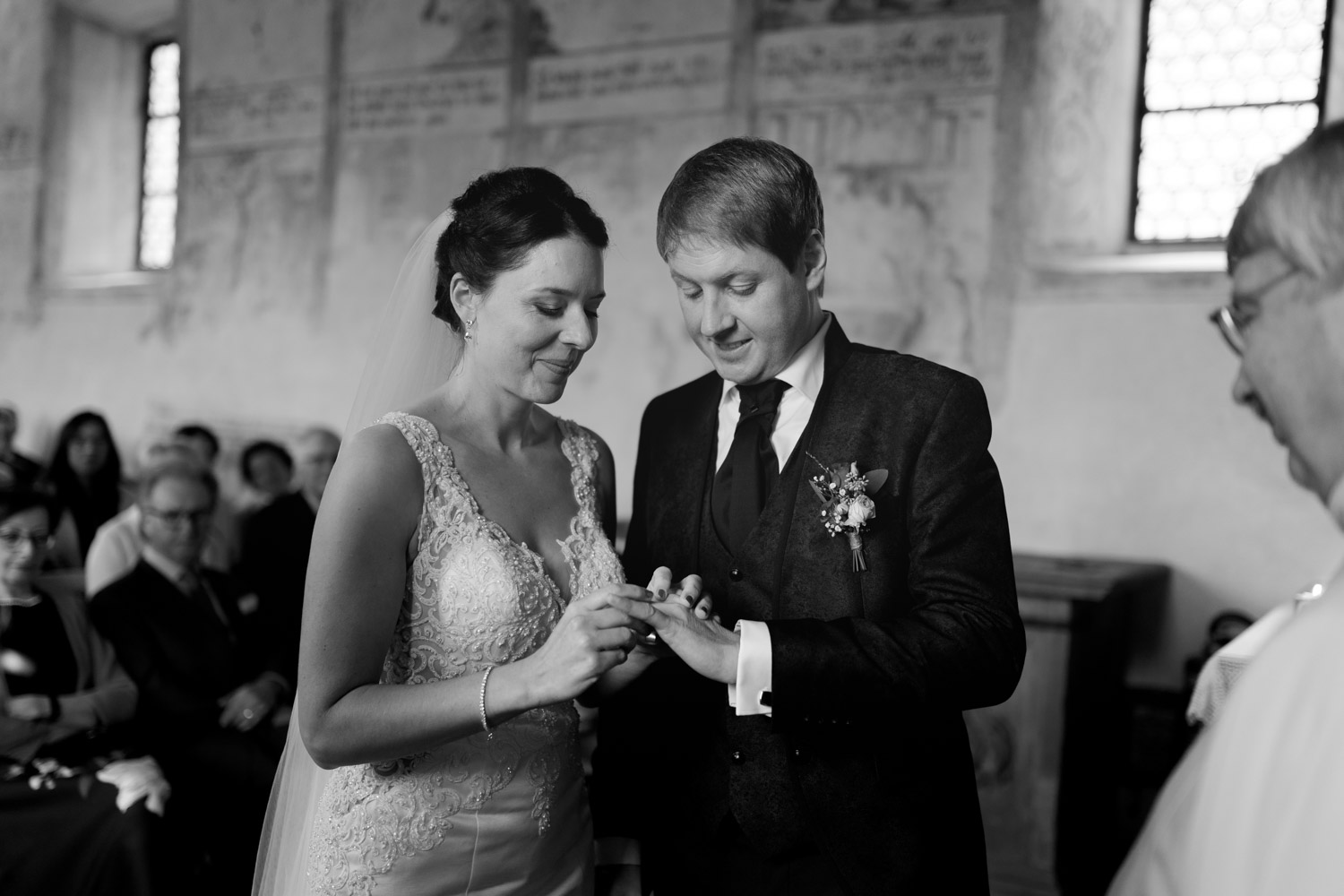Bride and groom exchanging rings in chapel in Ennetbürgen